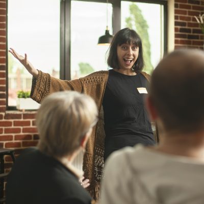 smiling lady shares good news at therapy